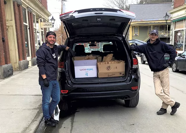 David Thomas (left) of Langdon Street Tavern and Nathan Magne of Union Mutual preparing to deliver meals - COURTESY