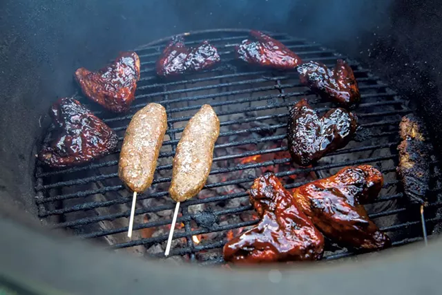 Chicken wings and kababs on the grill - JAMES BUCK