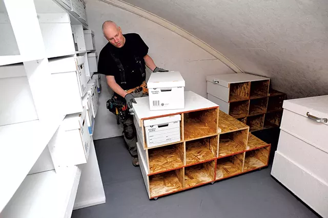 Tim Szad working on evidence storage racks - STEFAN HARD
