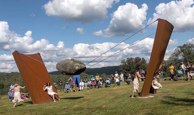 Murmurations Dance artists in front of "High Wire Act" - COURTESY OF COLD HOLLOW SCULPTURE PARK
