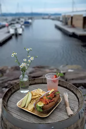 A lobster roll served with a strawberry-rhubarb gin and tonic - DARIA BISHOP