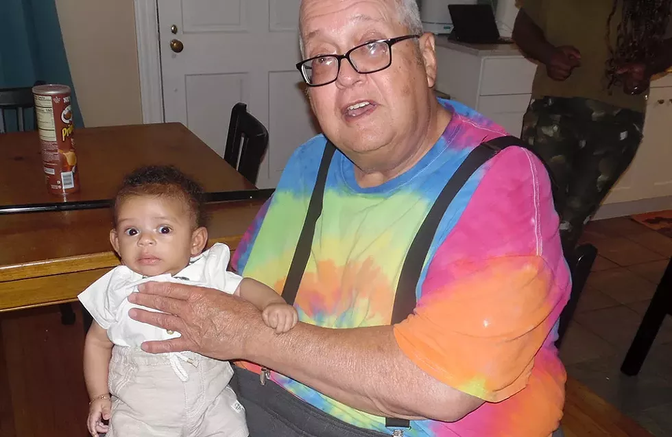 William Croteau holding his 28th grandchild - COURTESY IMAGE