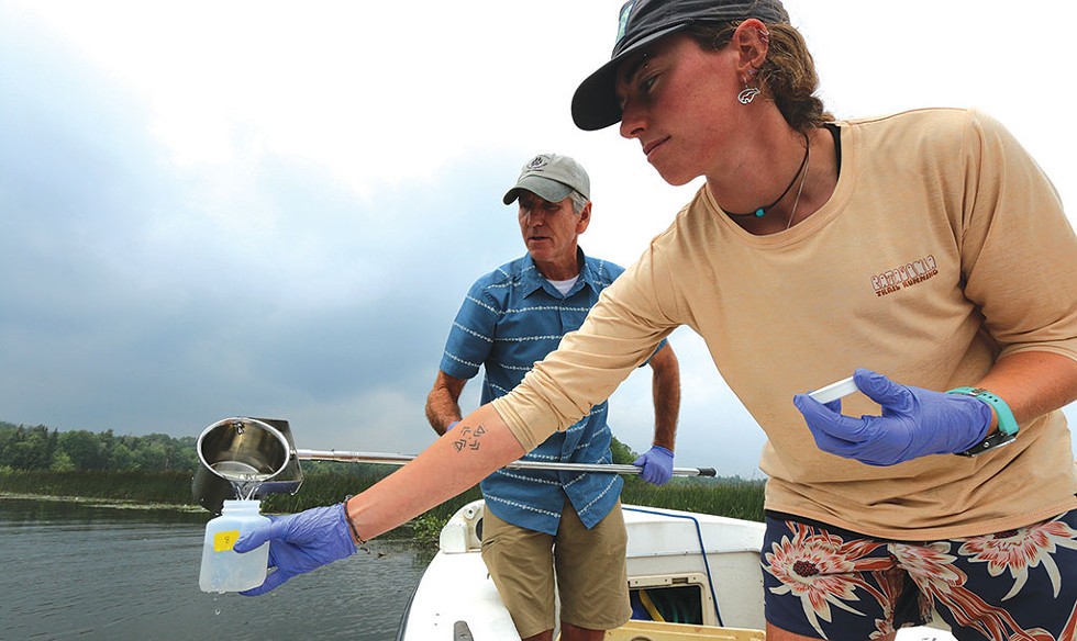 Rick Levey and Kelsey Colbert gathering water samples in Lake Memphremagog - KEVIN MCCALLUM ©️ SEVEN DAYS