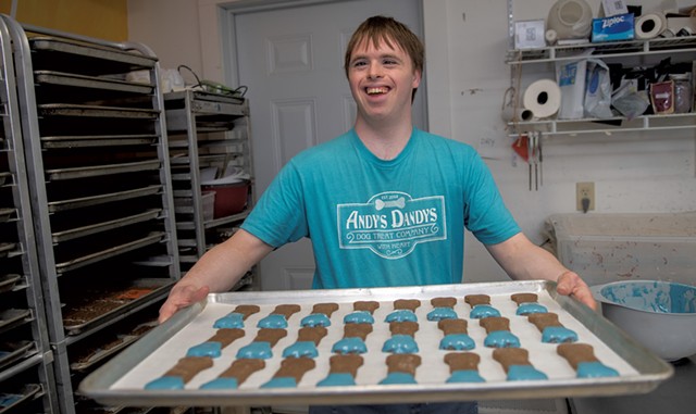 Co-owner Andrew Whiteford with a tray of dog treats - DARIA BISHOP