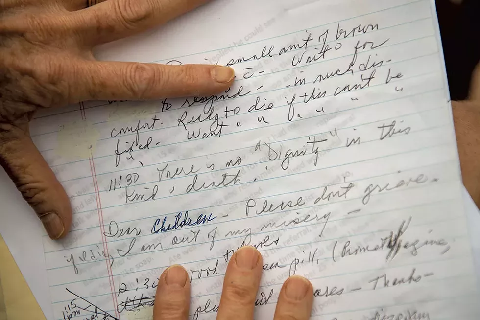 A daughter showing notes from her mother, who died last year while waiting to see a specialist at the University of Vermont Medical Center - DARIA BISHOP