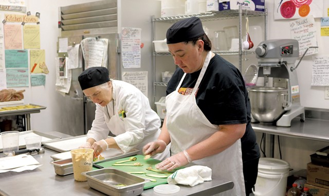 Chef-instructor Robin Burnet and participant Stacey Clarke in the Vermont Works for Women Fresh Food Enterprise training program in 2015 - COURTESY OF VERMONT WORKS FOR WOMEN