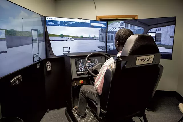Rolph Belizaire, a student at Pro Driver Training, practicing on the Virage truck simulator - LUKE AWTRY