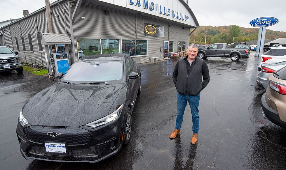 Rick Welcome with an all-electric Ford Mustang Mach-E at Lamoille Valley Ford in Hardwick - JEB WALLACE-BRODEUR
