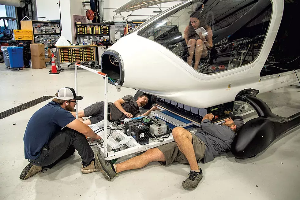 Beta Technologies engineers installing the aircraft's batteries - KEVIN MCCALLUM ©️ SEVEN DAYS