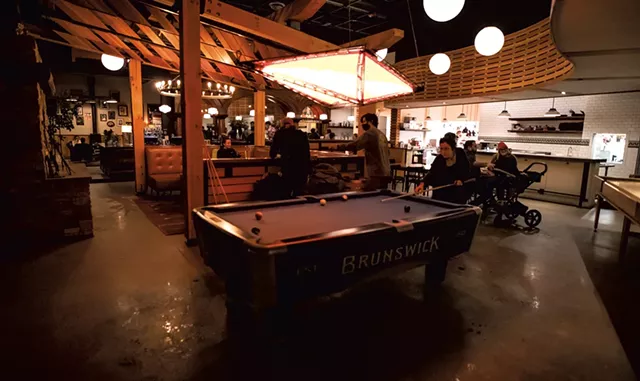 Patrons playing bar games - LUKE AWTRY