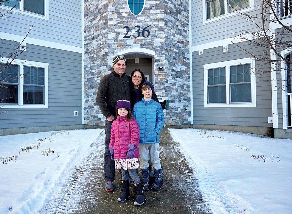 Dawn Serra with her husband, Jamie Lennox, and her two children, Bodhi and Siena, at their Williston apartment - BEAR CIERI