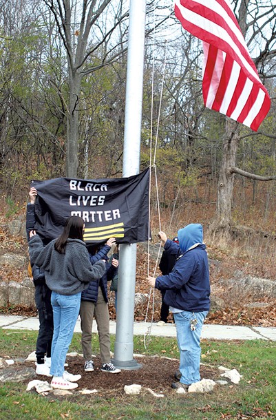 Burlington High School students raising the Black Lives Matter flag - COURTESY OF BURLINGTON SCHOOL DISTRICT