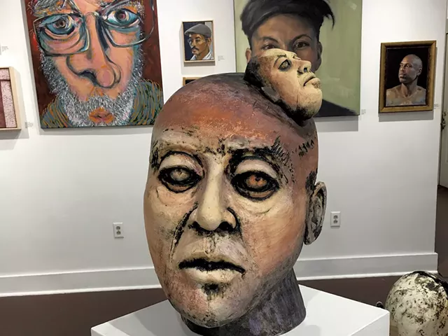 On wall, from left: "Portrait #158" by Charles Lysogorski, small untitled portraits and "Condor" by Ann Young, and "Study in Blue Light" by August Burns. Front: "Voices" by Susan H. Wilson - PAMELA POLSTON ©️ SEVEN DAYS