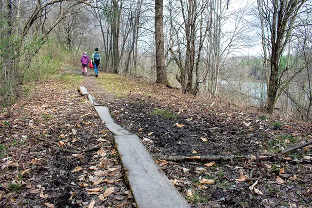 A wooden "bridge" across a muddy trail - COURTESY