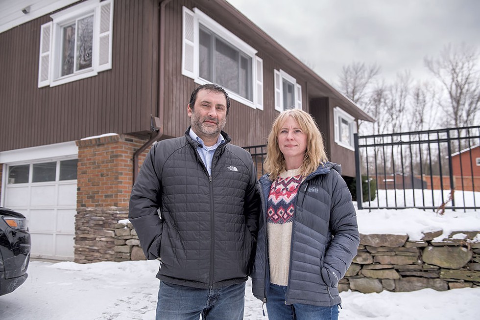 Chris and Nancy Badami in front of their Shelburne home - DARIA BISHOP