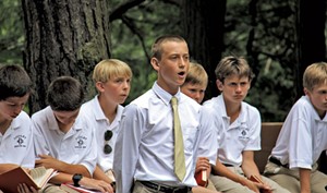 Every Sunday, the camp gathers for an outdoor chapel service by the lake where the boys can slow down and reflect on spiritual matters. - COURTESY OF CAMP DUDLEY
