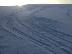 Making ski turns in the afternoon sunlight - SARAH GALBRAITH