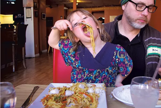 Mila enjoying chow mein - COURTESY OF MEREDITH COEYMAN