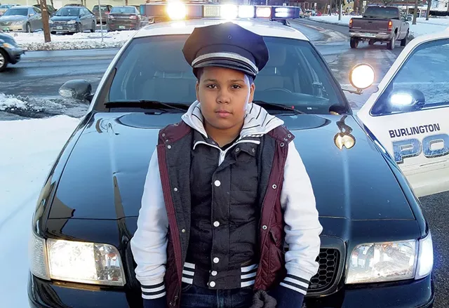 Javain Headley - checks out a - Burlington police cruiser. - MATTHEW THORSEN