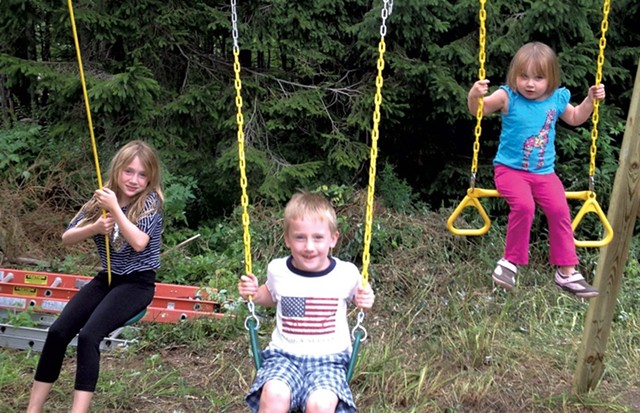 The Harle children on the attached swingset - COURTESY OF RICHARD HARLE