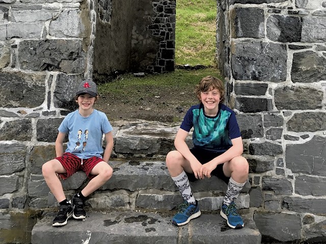 Leo and Felix sit on the stairs of "His Majesty's Fort of Crown Point" - COURTESY OF BENJAMIN ROESCH