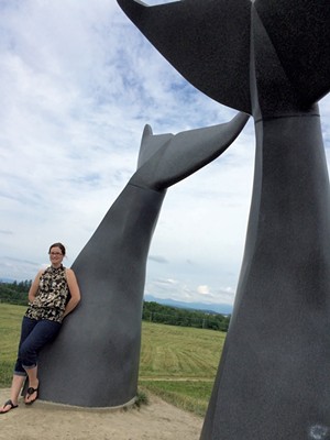 Erin Rounds in front of the "Reverence" sculpture in South Burlington - COURTESY OF ERIN ROUNDS