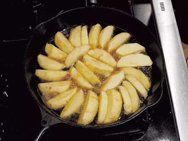 Apples arranged on top of a layer of caramel - ANDY BRUMBAUGH