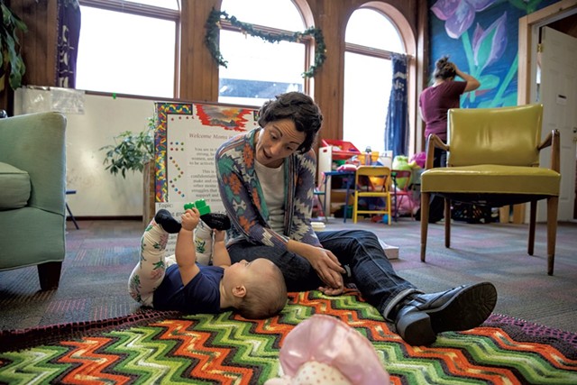 Kelly Breeyear plays with a baby at the New Moms in Recovery Program she runs at Turning Point - JAMES BUCK