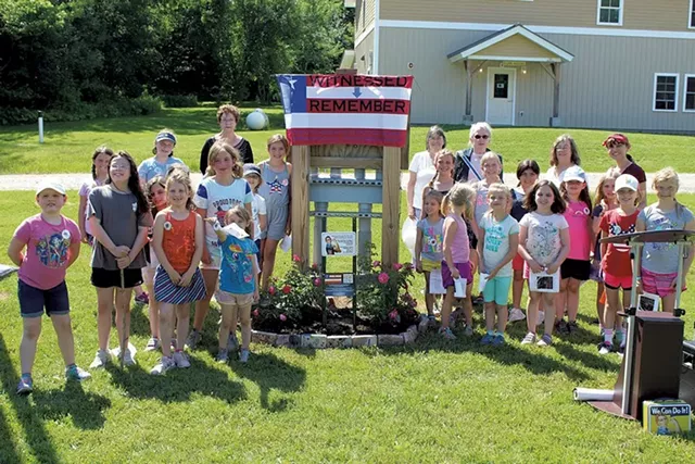 Girls at Camp Farnsworth flank the new Rosie the Riveter garden - COURTESY OF GIRL SCOUTS OF THE GREEN AND WHITE MOUNTAINS