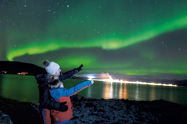 Max and his mom viewing the Northern Lights from the Arctic Circle