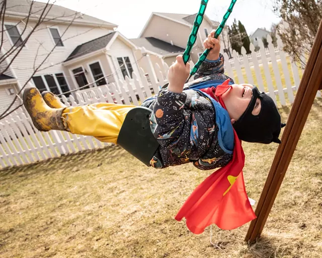 Bo swings in his cape and mask - CAT CUTILLO