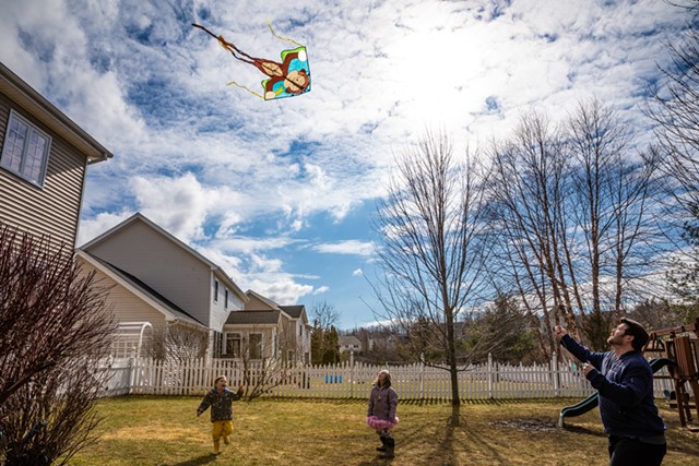 Backyard kite flying - CAT CUTILLO