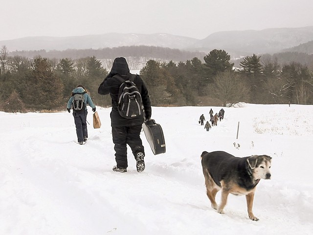 Students hiking down to base camp with Schlein's dog, Puck - CAT CUTILLO