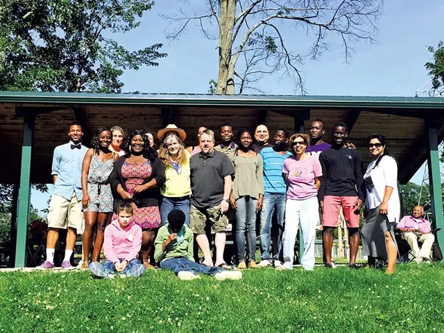 Theresa Tomasi with 18 of her children - COURTESY OF TAI TOMASI