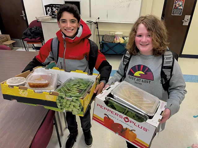 Sebastian Fouche (left) and Levi Duteau taking home dinner for their families - MARY ANN LICKTEIG