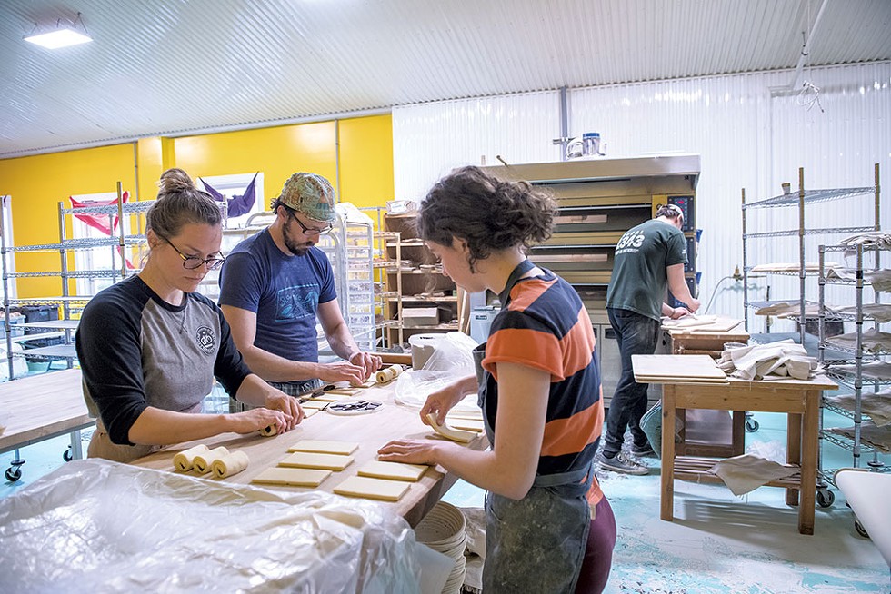 From left: Olya Virgalla, Scott Medellin, Marissa Swartley and Keir Schofield making baked goods at Slowfire Bakery - DARIA BISHOP