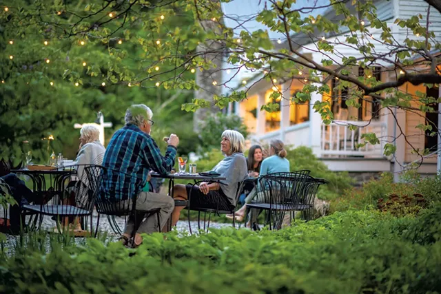 Outdoor dining at the restaurant - CALEB KENNA