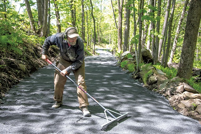 Greg Western smoothing out fresh trailbed material - JEB WALLACE-BRODEUR