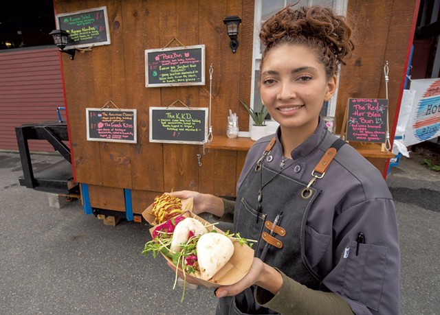 Tiffany Perkins with bao buns and corn dogs at the Red Hot Blue - JEB WALLACE-BRODEUR