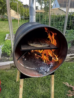 Tarte flambée baking in a WoodFyred oven - MELISSA PASANEN