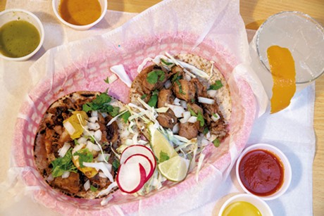 Al pastor and carnitas tacos with house sauces and house margarita - JAMES BUCK