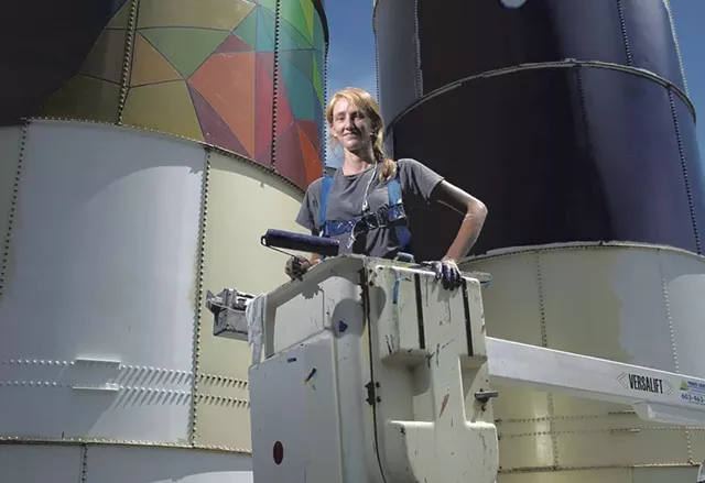 Mary Lacy painting silos at Dealer.com - FILE: MATTHEW THORSEN