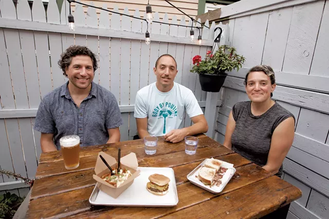 From left: Michael, Joe and Leah Collier of Maudite Poutine - LUKE AWTRY