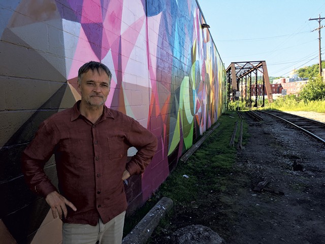 Ward Joyce in front of a mural by Mauricio Ramirez - PAMELA POLSTON ©️ SEVEN DAYS
