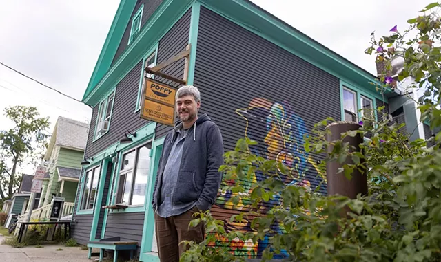 Matt Cropp outside the Oak Street Co-op in Burlington, which houses local eateries Poppy and Café Mamajuana - JAMES BUCK