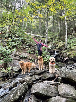 Sarah Kalil with her canine hiking companions in Stowe - COURTESY