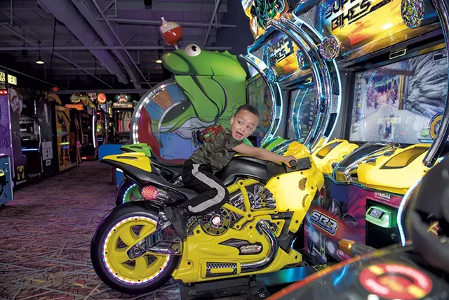Devonte Brooks driving a virtual motorcycle - DARIA BISHOP