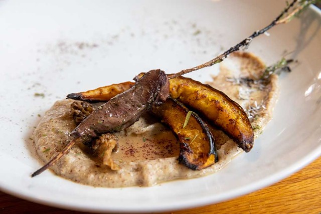 Venison heart on a torched cedar skewer with Calais flint corn mush, maple-roasted squash and morel sauce - JAMES BUCK