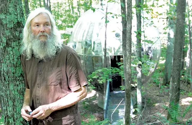 Russ Bennett in front of giant mirror ball from Super Ball IX - JEB WALLACE-BRODEUR