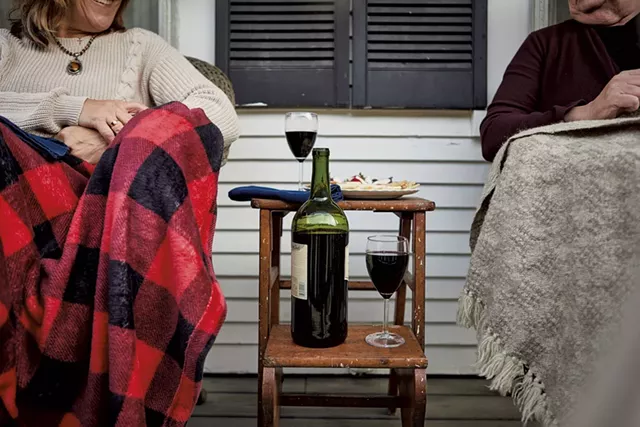Guests enjoying wine on the porch at Liberty Hill Farm - COURTESY OF JESSICA SIPE